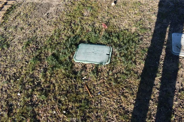 an aerial view of a house with a lake view