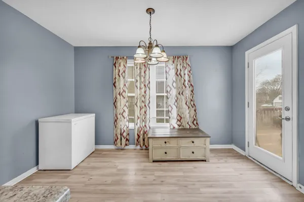a view of an entryway with a chandelier