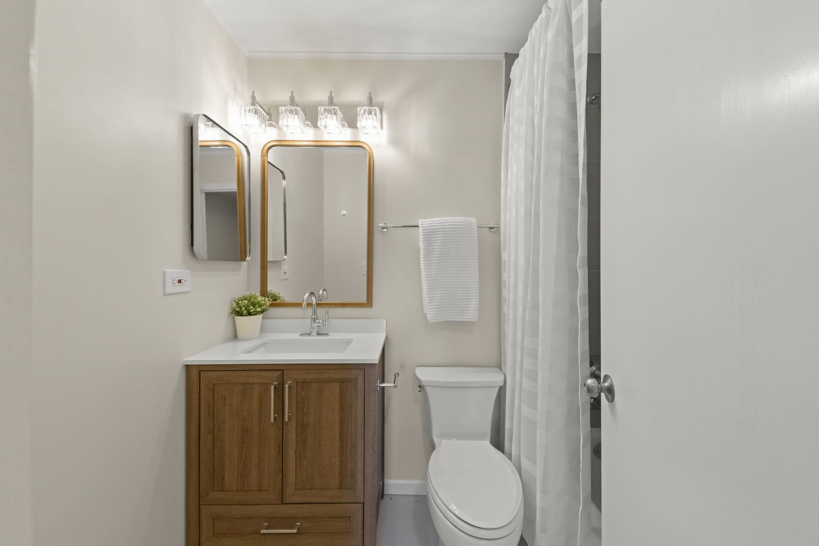 2235 Highfield Court Aurora, IL 60504 - Photo 17 of 31 a bathroom with a toilet a sink and mirror