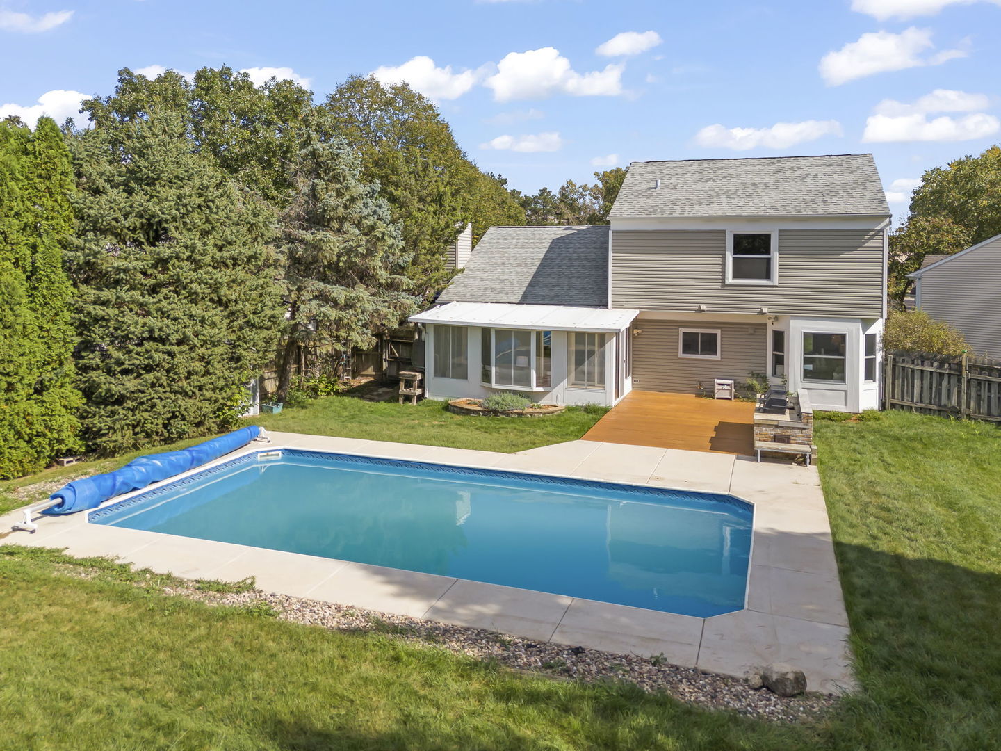 2235 Highfield Court Aurora, IL 60504 - Photo 3 of 31 a view of an house with swimming pool and chairs