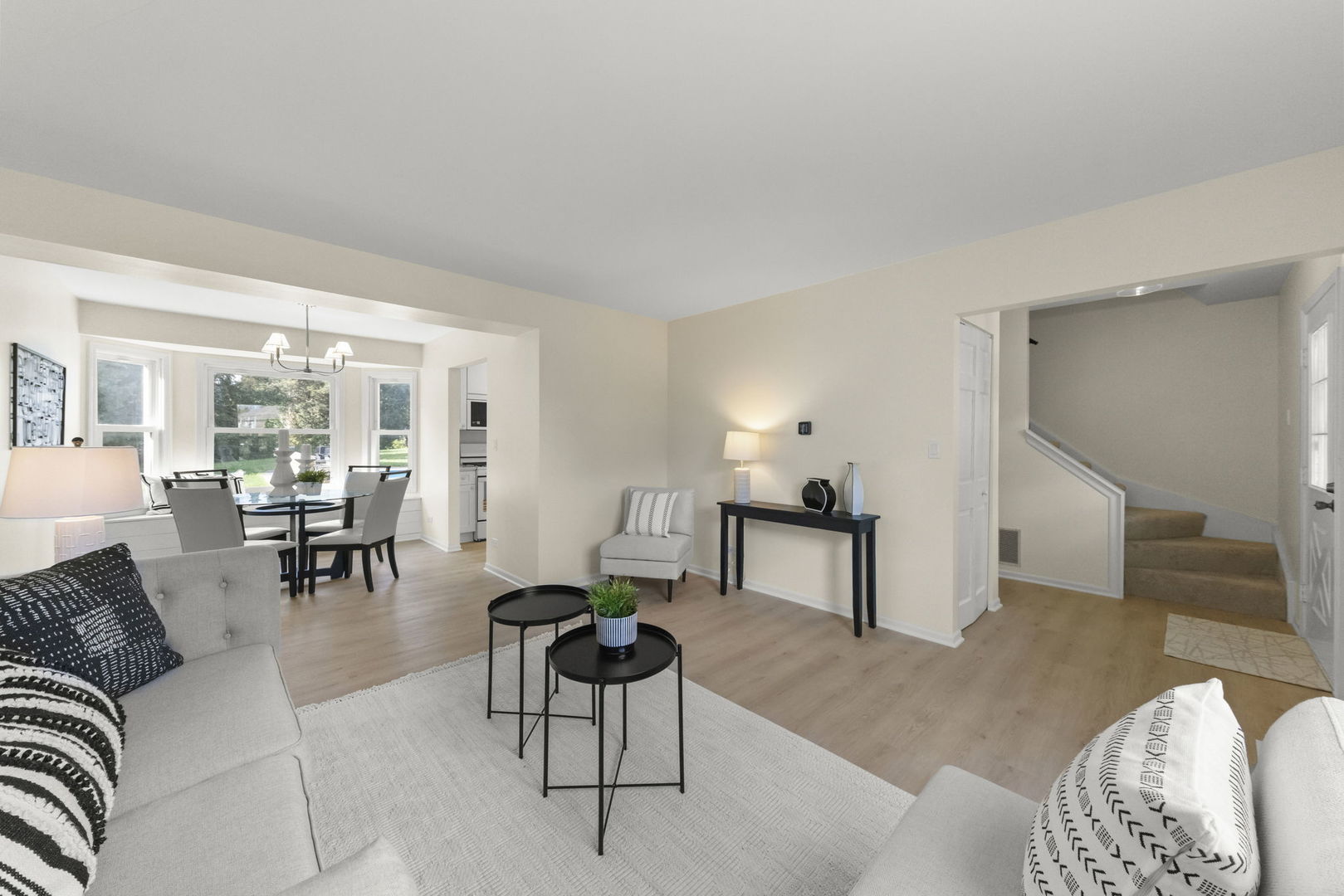 2235 Highfield Court Aurora, IL 60504 - Photo 5 of 31 a living room with furniture and a dining table with kitchen view