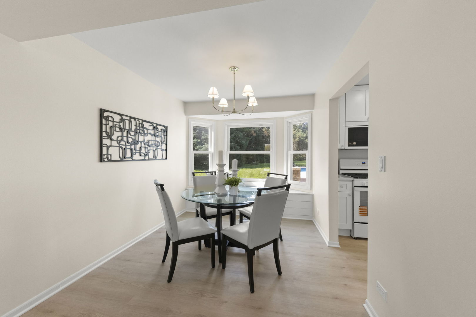2235 Highfield Court Aurora, IL 60504 - Photo 6 of 31 a view of a dining room with furniture and a chandelier