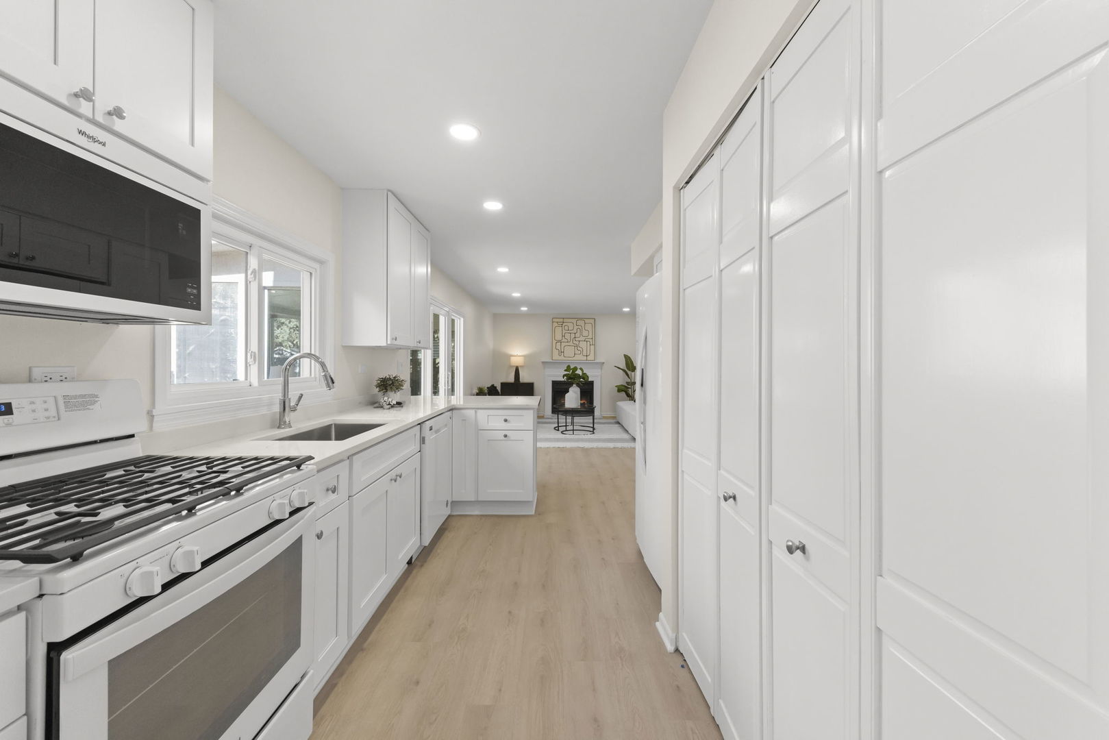 2235 Highfield Court Aurora, IL 60504 - Photo 8 of 31 a large kitchen with a stove and a sink