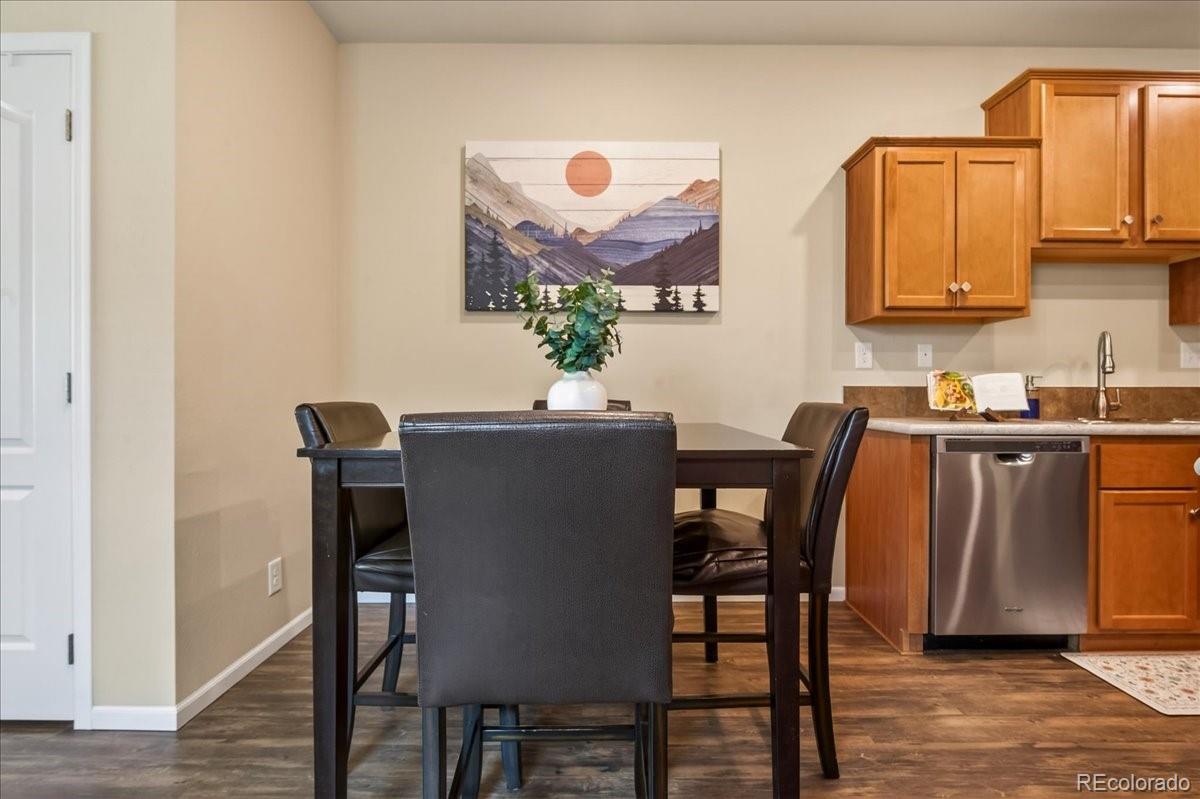 53 Brook Trout Loop Gypsum, CO 81637 - Photo 8 of 38 a dining room with furniture and wooden floor