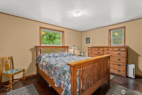 a bedroom with a bed and a dresser