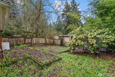 a backyard of a house with lots of green space