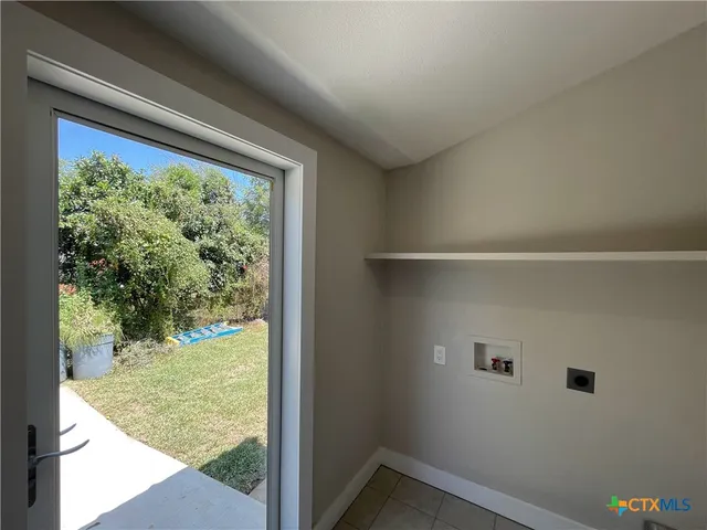 a view of a room with a large window