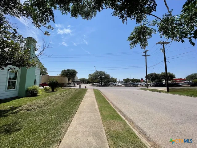 a view of swimming pool with a yard