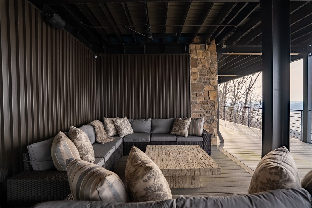 2623 Alum Cave Road Bee Branch, AR 72013 - Photo 58 of 60 Covered outdoor patio featuring slatted wall panels and a stone column