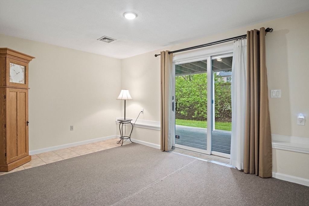 1 Abington Road, Unit 1 Danvers, MA 01923 - Photo 25 of 31 a view of room with window and a ceiling fan