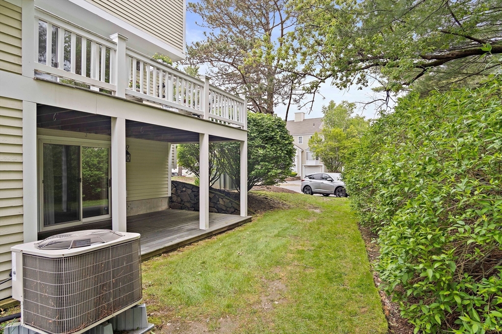 1 Abington Road, Unit 1 Danvers, MA 01923 - Photo 27 of 31 a backyard of a house with yard and outdoor seating