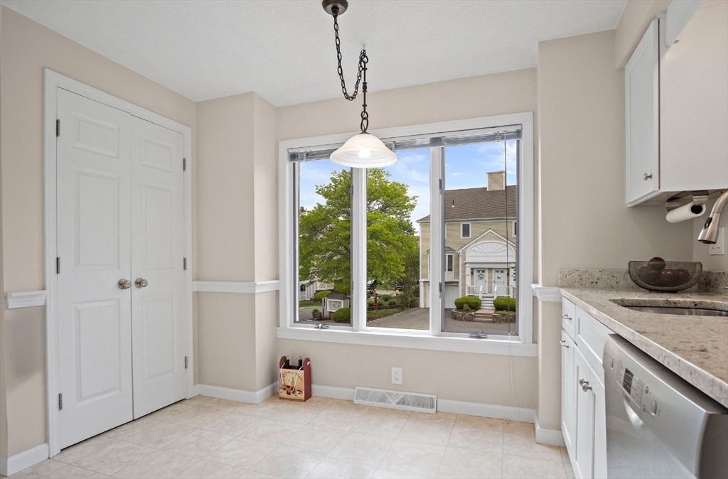 1 Abington Road, Unit 1 Danvers, MA 01923 - Photo 5 of 31 a spacious bathroom with a granite countertop tub and a window