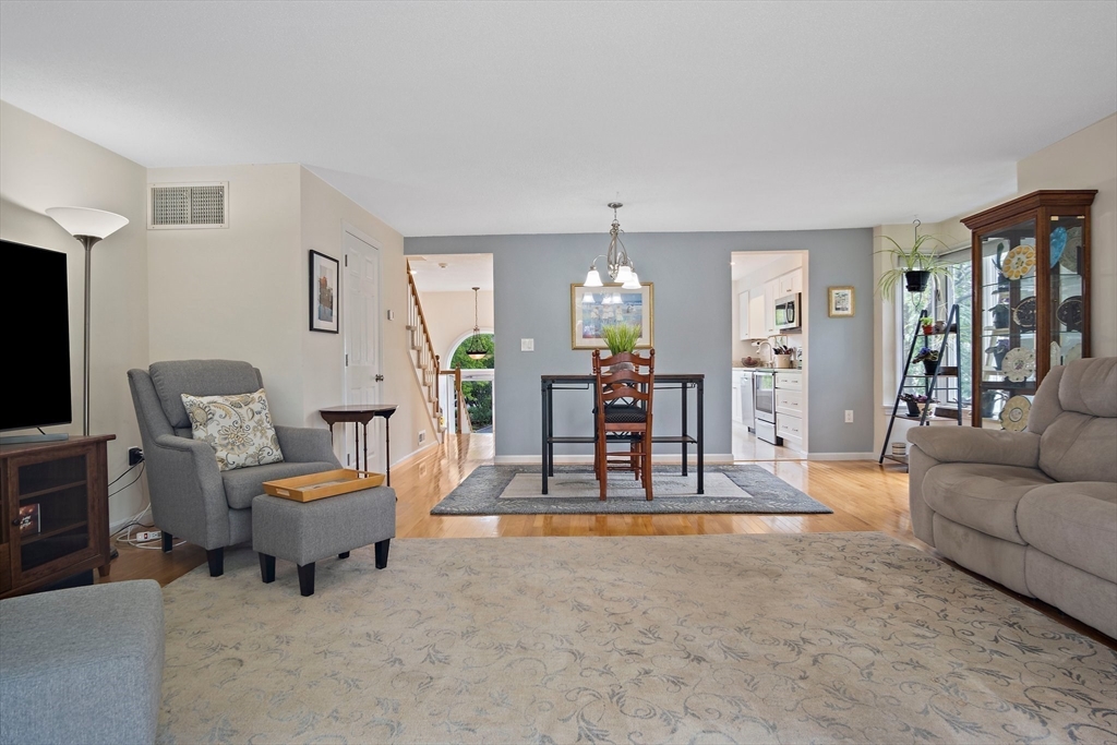 1 Abington Road, Unit 1 Danvers, MA 01923 - Photo 6 of 31 a living room with furniture and wooden floor