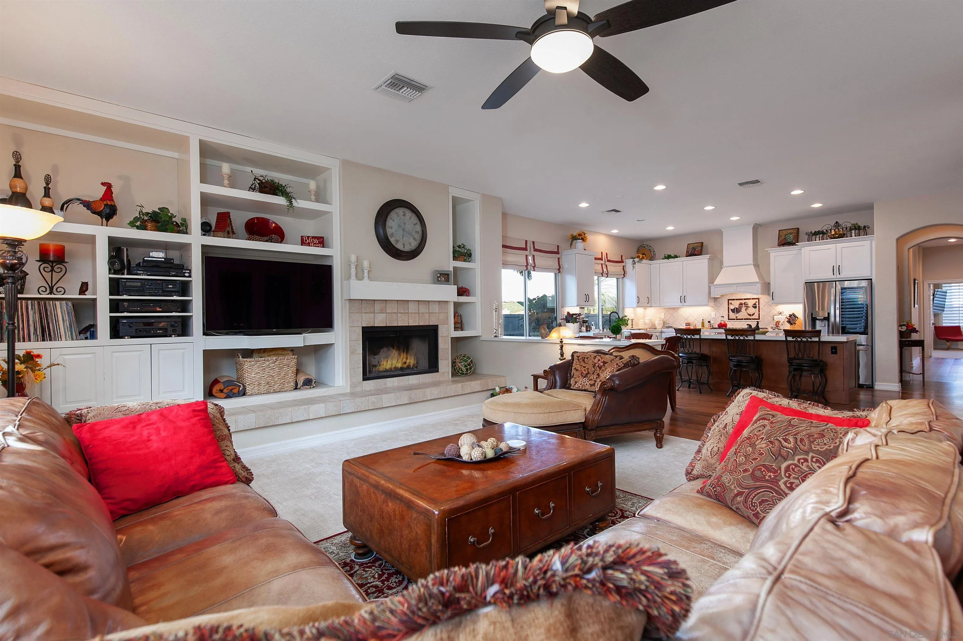 11760 Treadwell Drive Poway, CA 92064 - Photo 13 of 52 a living room with furniture a flat screen tv and a fireplace