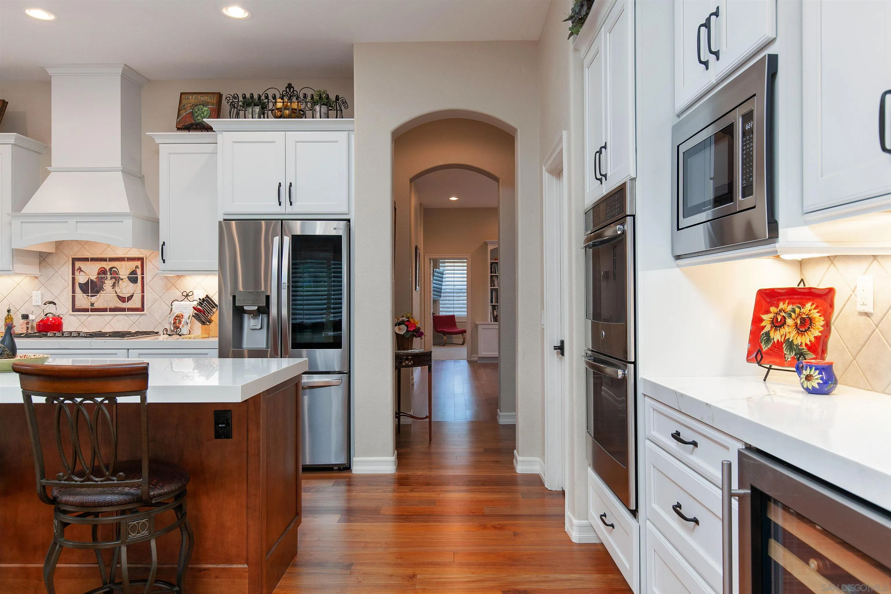 11760 Treadwell Drive Poway, CA 92064 - Photo 21 of 52 a kitchen with stainless steel appliances granite countertop a refrigerator and a stove top oven