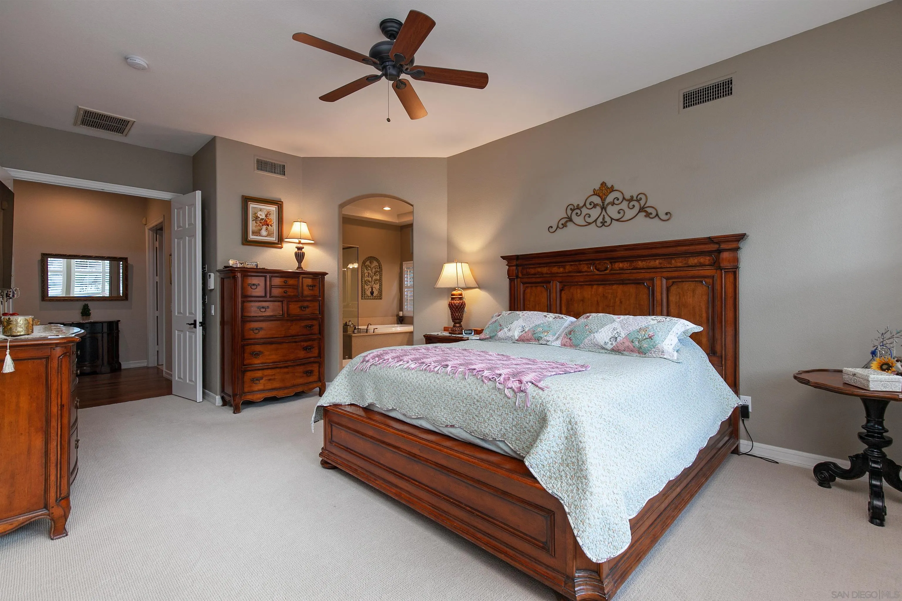 11760 Treadwell Drive Poway, CA 92064 - Photo 24 of 52 a bedroom with a bed and a chandelier