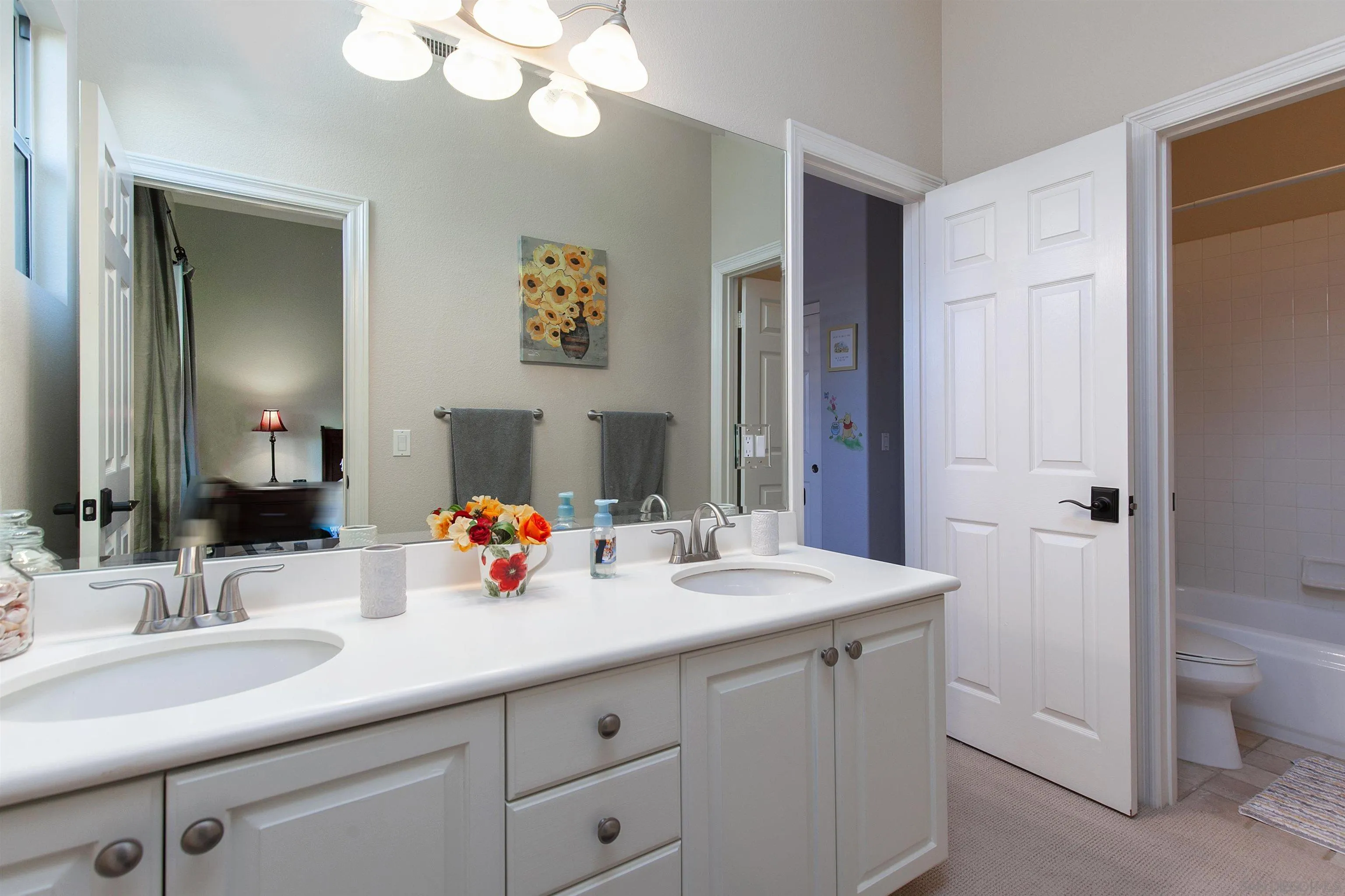 11760 Treadwell Drive Poway, CA 92064 - Photo 32 of 52 a bathroom with a sink double vanity and a mirror
