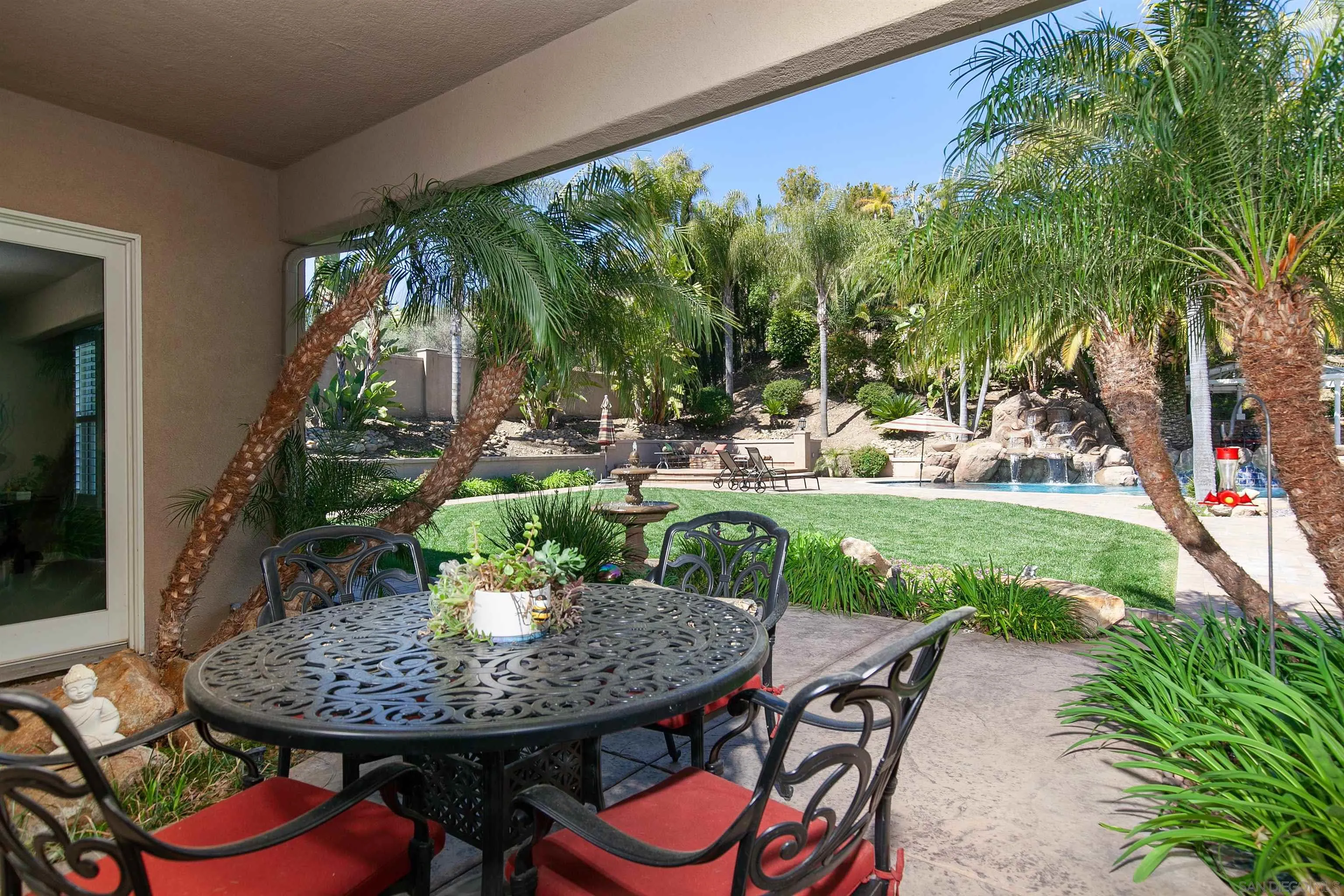 11760 Treadwell Drive Poway, CA 92064 - Photo 49 of 52 a view of a patio with a table chairs and a swimming pool