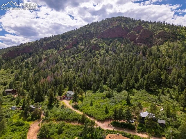 a view of a lake with houses in the back