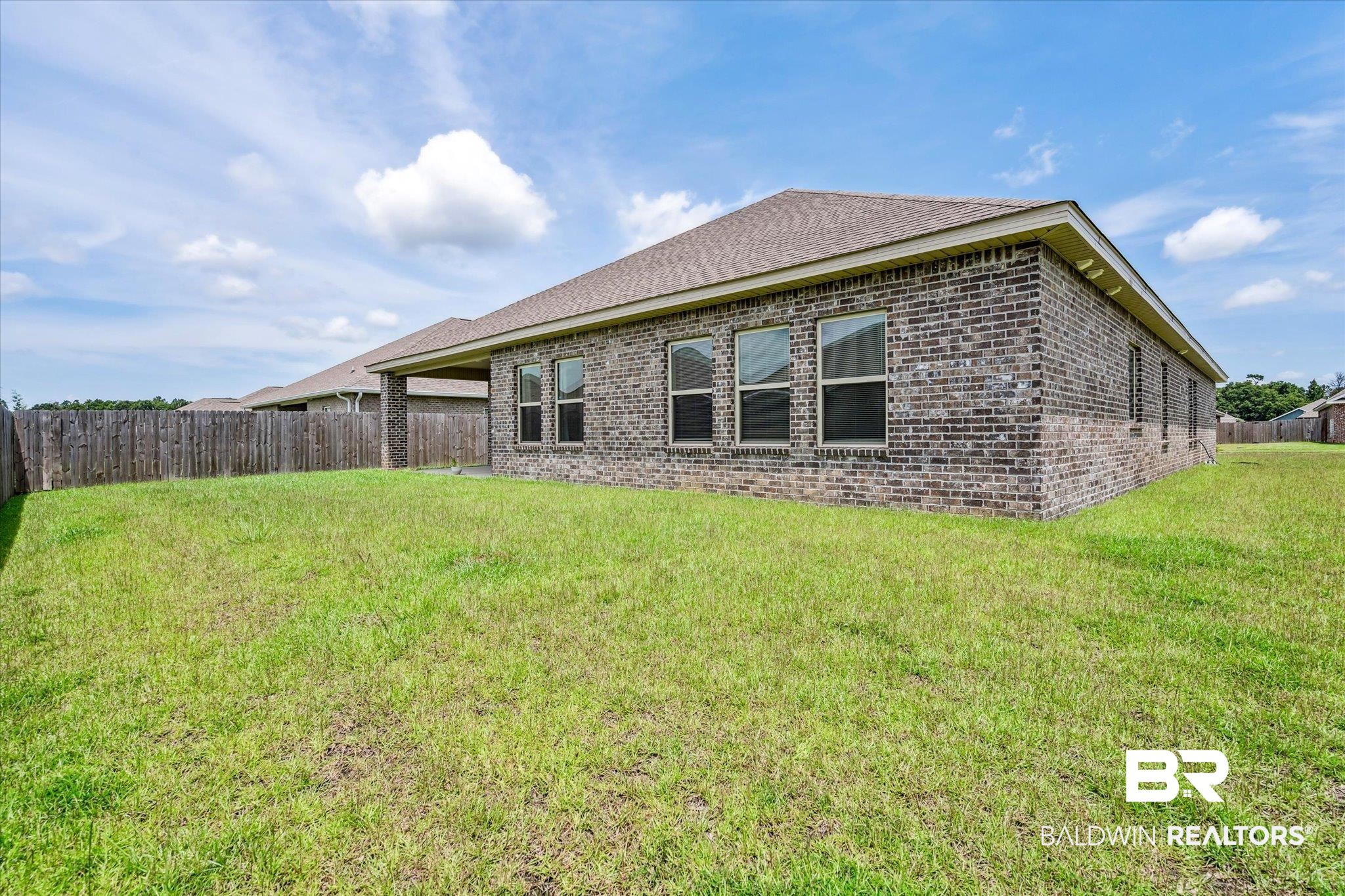 10501 Loamy Avenue Mobile, AL 36695 - Photo 28 of 30 Back of house with a lawn
