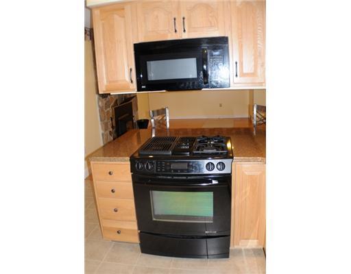 330 Maguire Road Kennebunk, ME 04043 - Photo 8 of 25 Kitchen. Jenn-air range looking into...