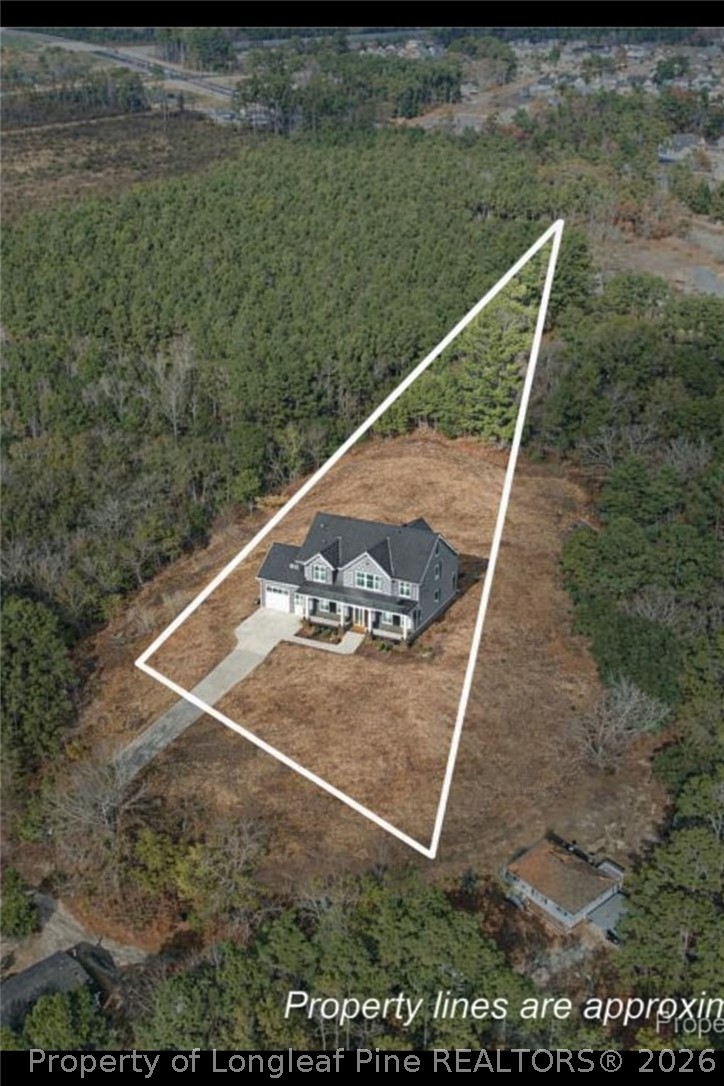 7536 Glen Raven Road Fayetteville, NC 28306 - Photo 15 of 15 a view of a backyard with plants