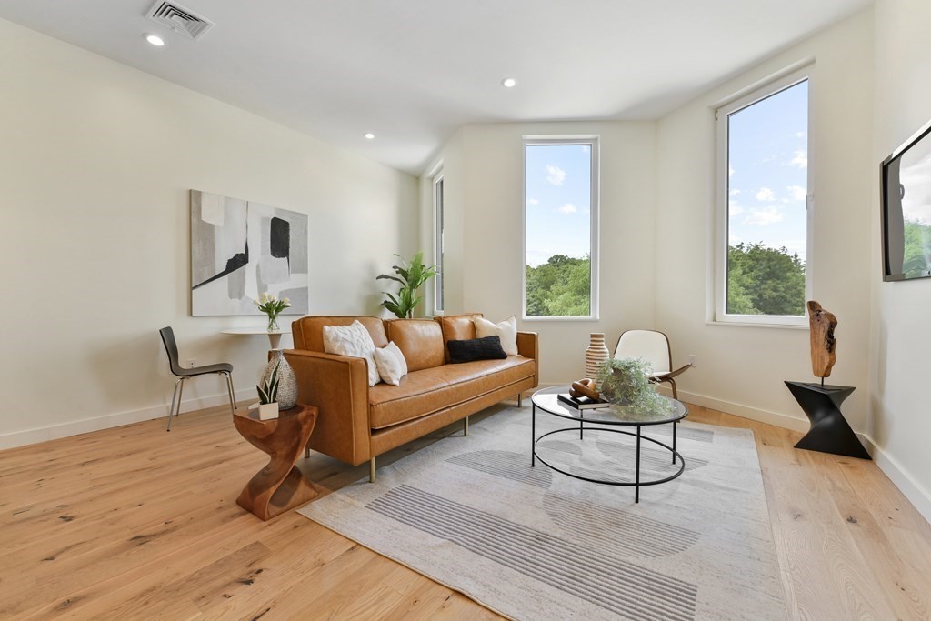 80 Terrace Street, Unit 302 Boston, MA 02120 - Photo 5 of 18 a living room with furniture and a window