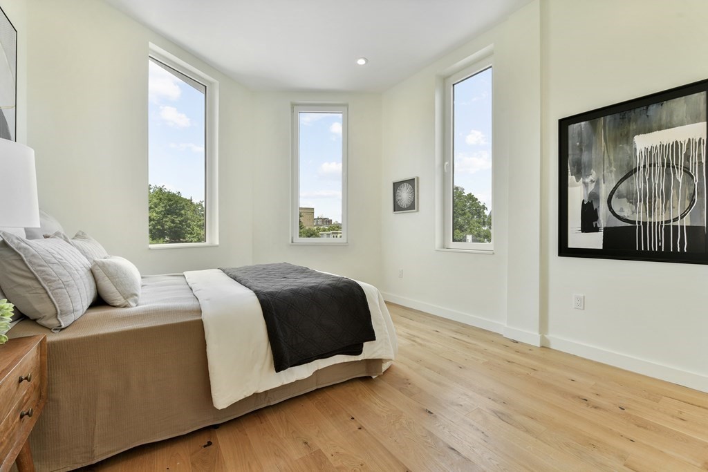 80 Terrace Street, Unit 302 Boston, MA 02120 - Photo 9 of 18 a bedroom with a bed and window