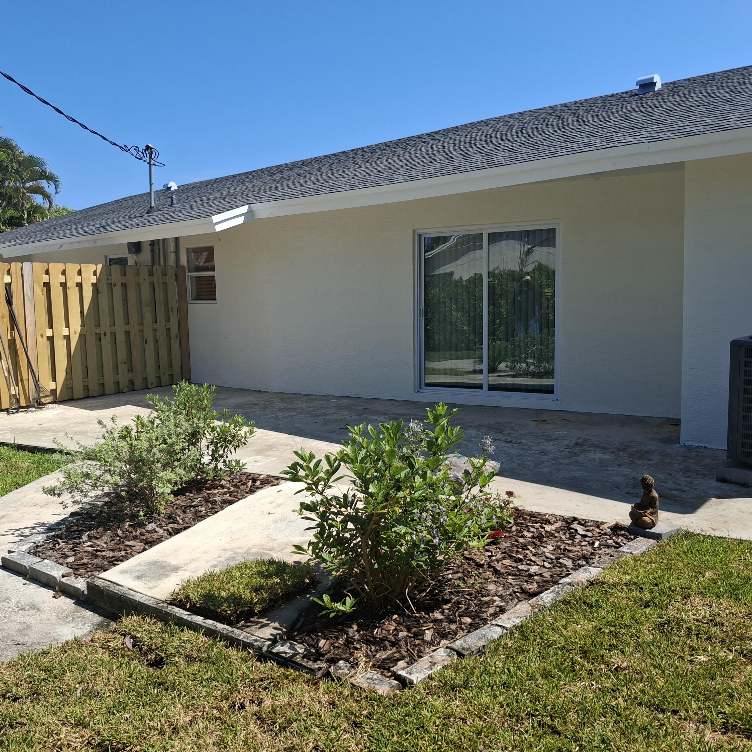 1097 Wilkinson Road, Unit B Lake Worth, FL 33462 - Photo 19 of 21 Backyard-Patio