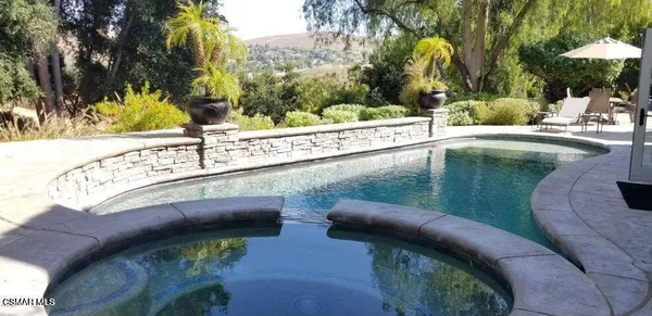 a view of a swimming pool with a patio