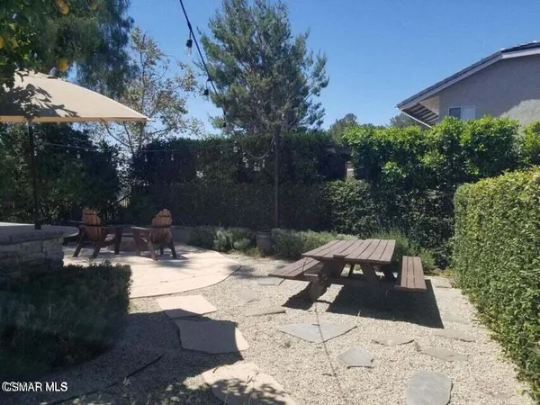 a view of backyard with a patio