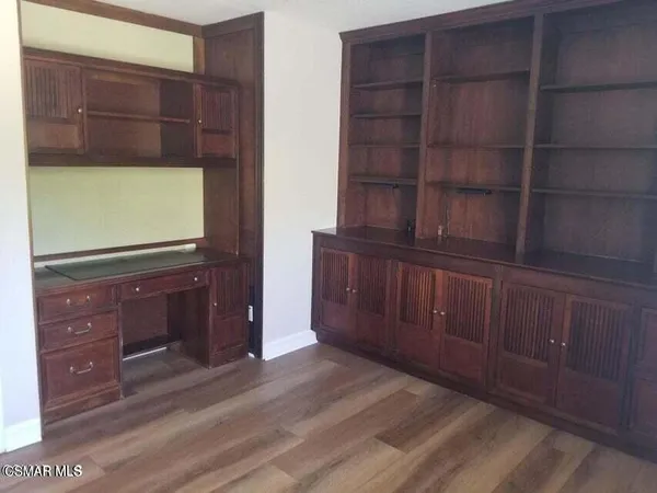 a view of wooden floor and cabinet