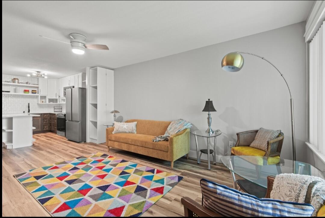 210 Pelham Road, Unit 211B Fort Walton Beach, FL 32547 - Photo 3 of 7 a living room with furniture and a couch