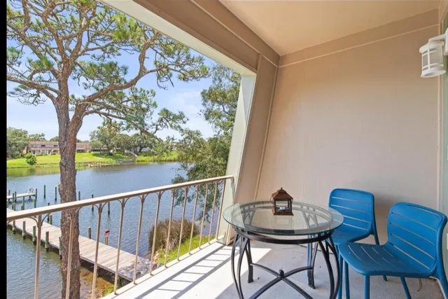 a view of a chairs and table in patio