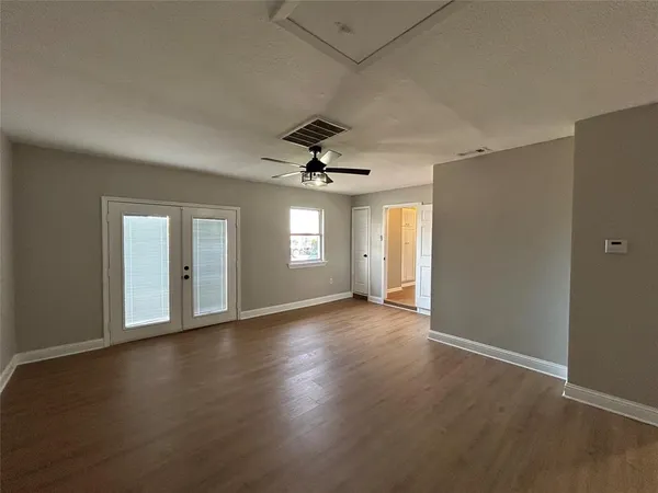 a view of an empty room with a window