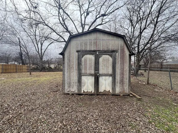 a house with trees in front of it