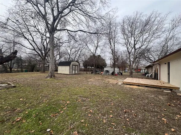 a view of street view with large trees