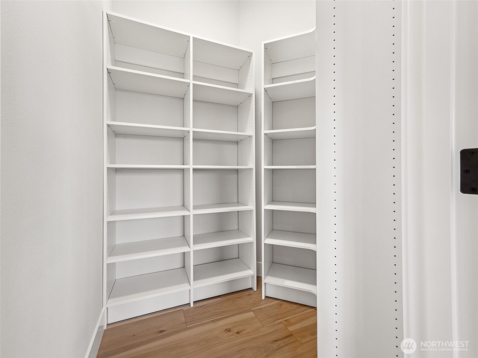 7226 227th Street East Graham, WA 98338 - Photo 12 of 31 a view of walk in closet with empty racks