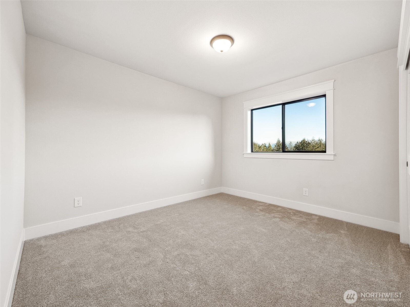 7226 227th Street East Graham, WA 98338 - Photo 19 of 31 an empty room with a window