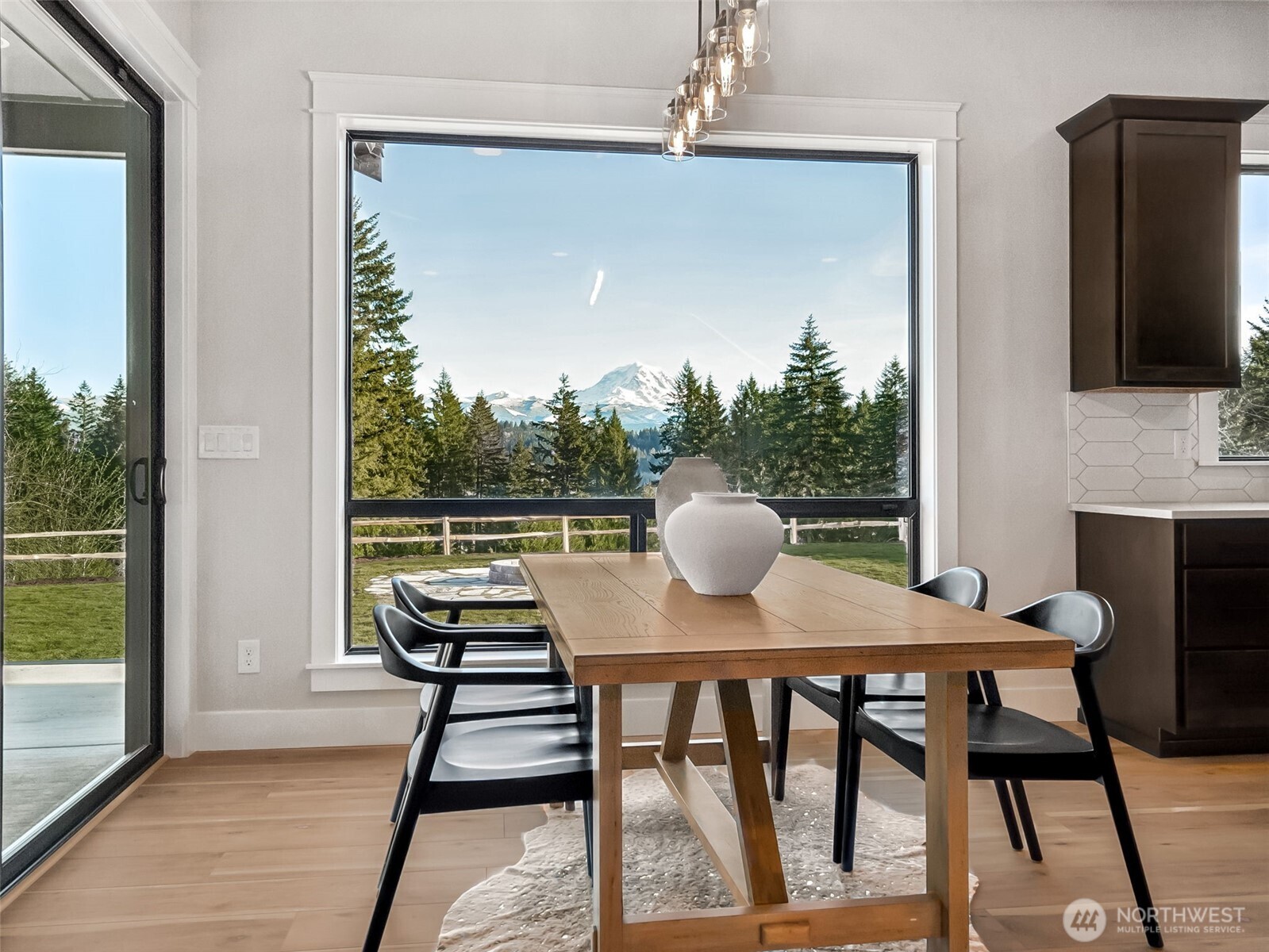 7226 227th Street East Graham, WA 98338 - Photo 9 of 31 a view of a dining room with furniture window and wooden floor
