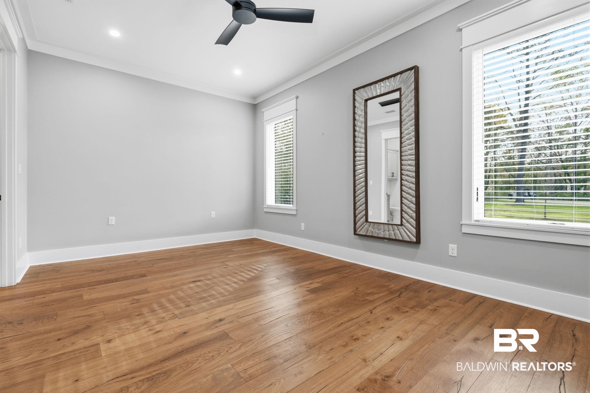 9501 Ben Hamilton Road Theodore, AL 36582 - Photo 40 of 69 Spare room featuring wood-type flooring, ornamental molding, ceiling fan, and recessed lighting