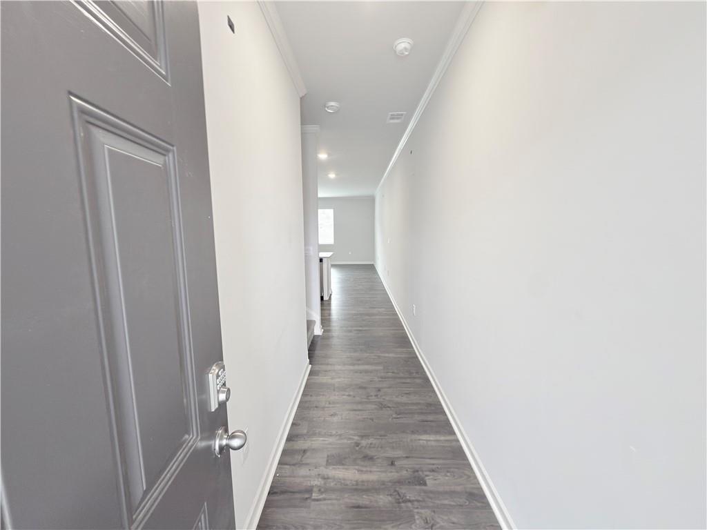 2715 Poppy Court Buford, GA 30519 - Photo 13 of 31 a view of a hallway with wooden floor