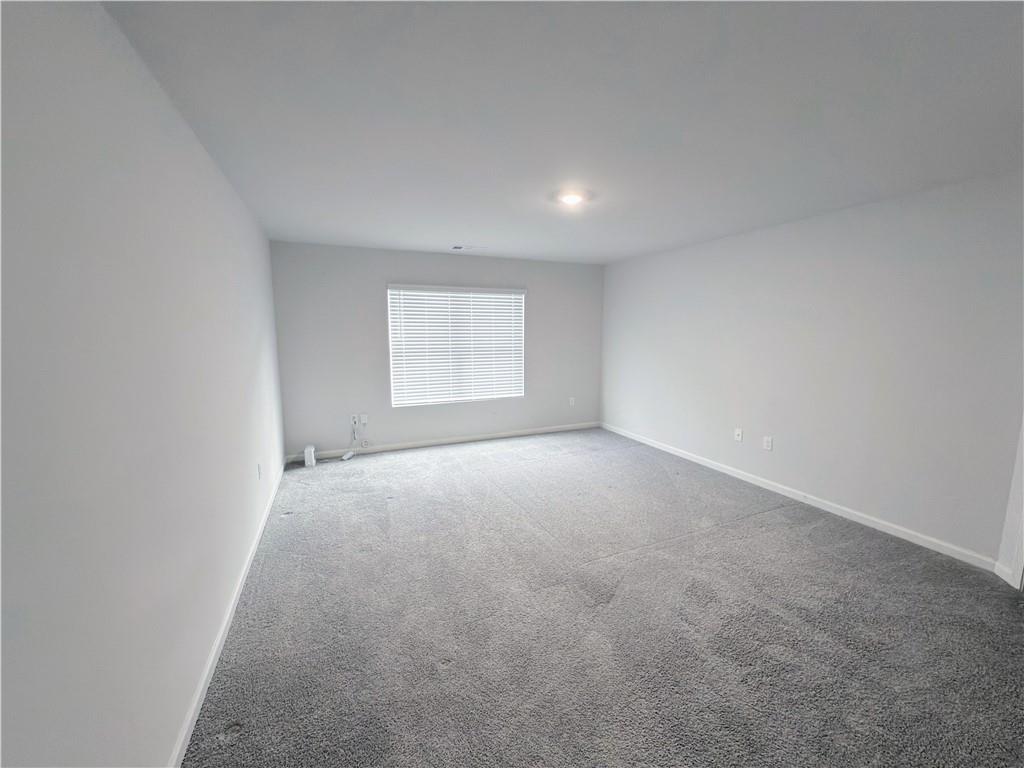 2715 Poppy Court Buford, GA 30519 - Photo 16 of 31 an empty room with a window