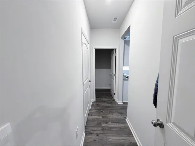 a view of a garage room and utility room