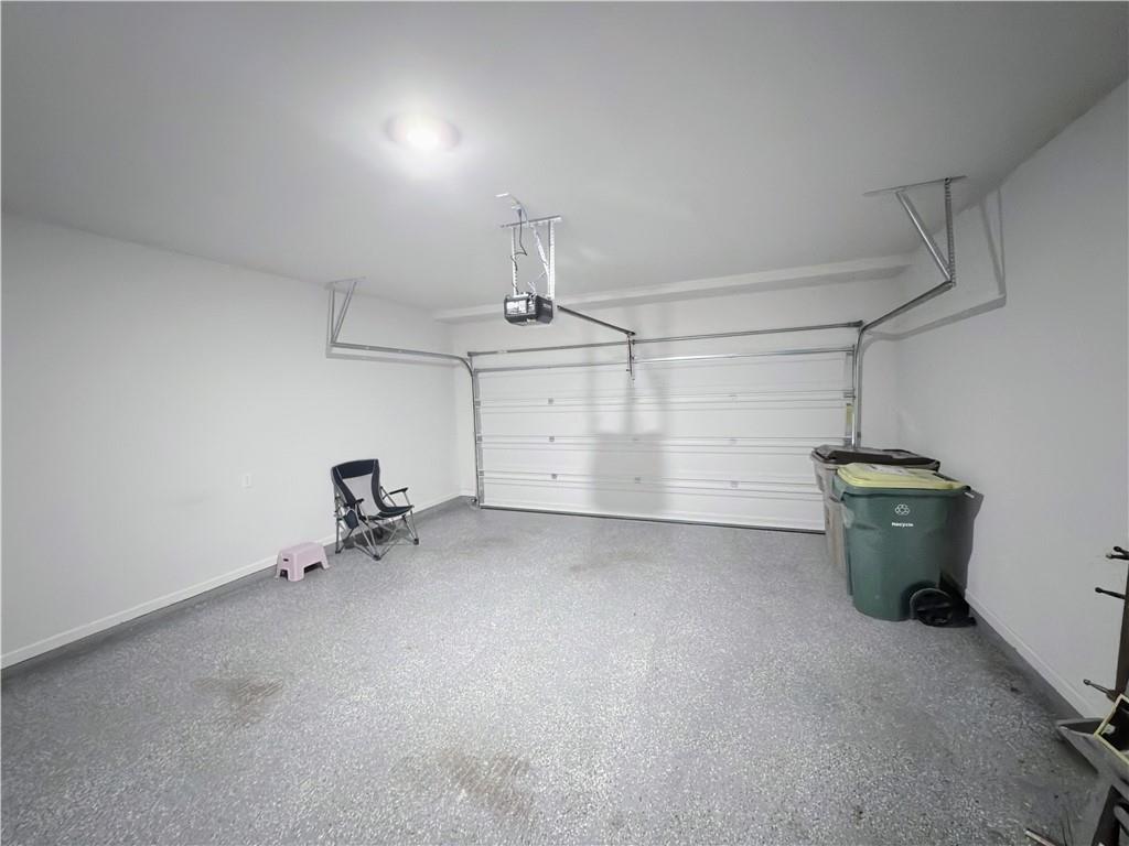 2715 Poppy Court Buford, GA 30519 - Photo 28 of 31 a view of a garage room and utility room