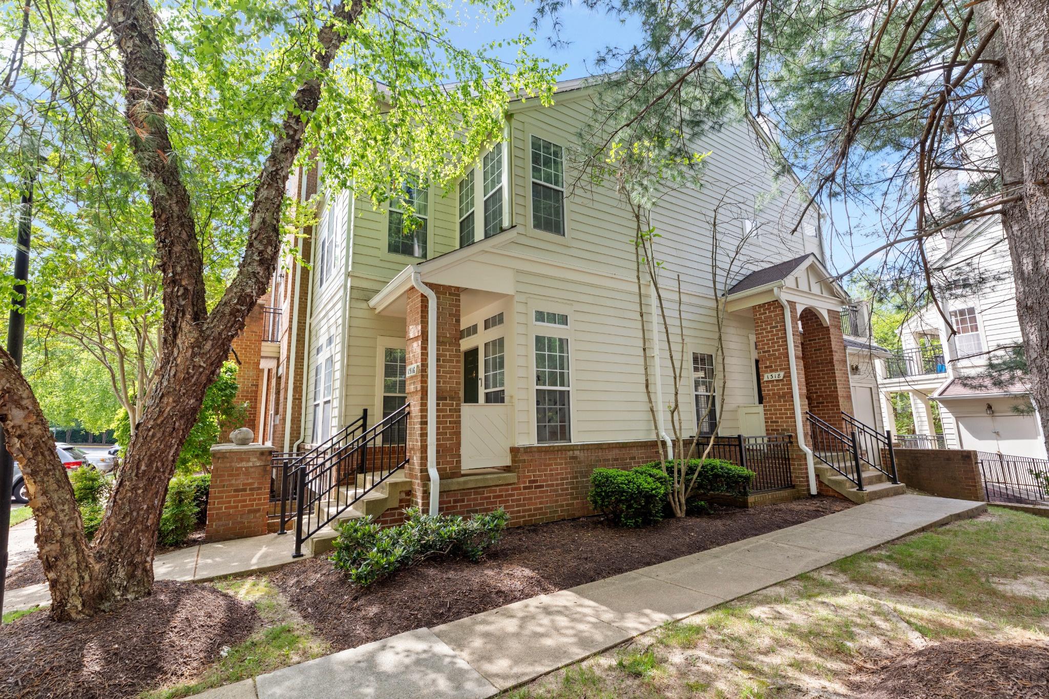 1318 Garden Wall Circle, Unit 213 Reston, VA 20194 - Photo 22 of 22 Charming home with lush greenery.