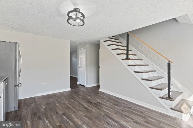 a view of entryway with wooden floor
