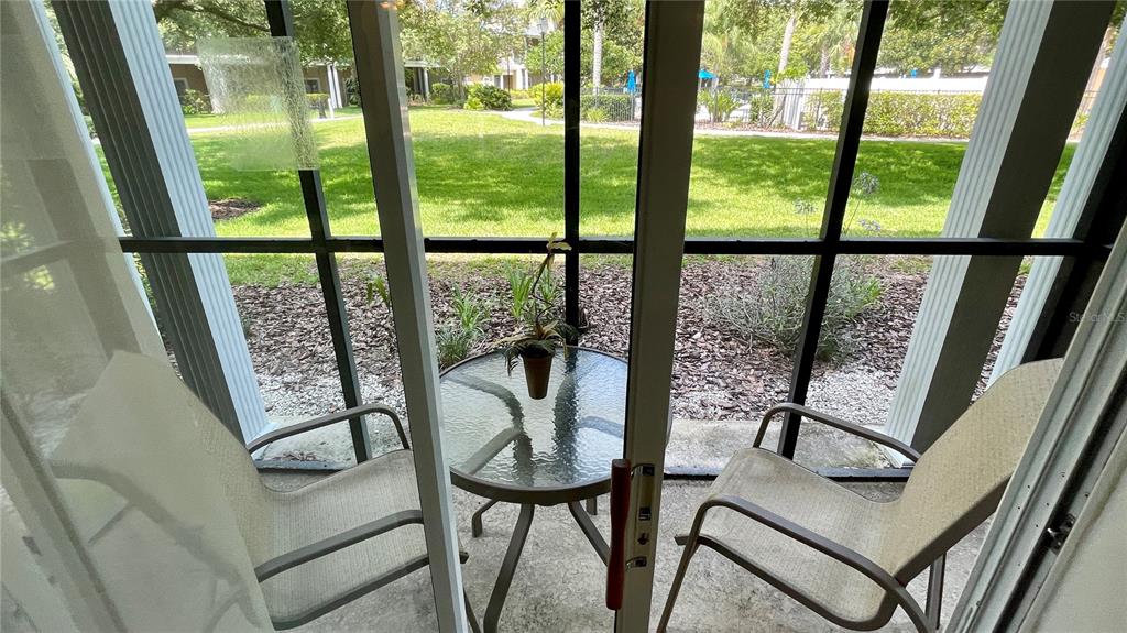 202 Rum Run, Unit 36102 Davenport, FL 33897 - Photo 14 of 21 a view of a floor to ceiling window with wooden floor