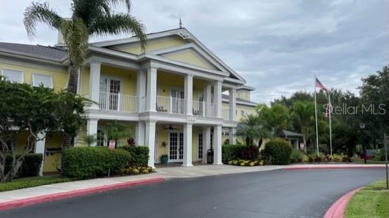 202 Rum Run, Unit 36102 Davenport, FL 33897 - Photo 21 of 21 a front view of a house with a garden and palm trees