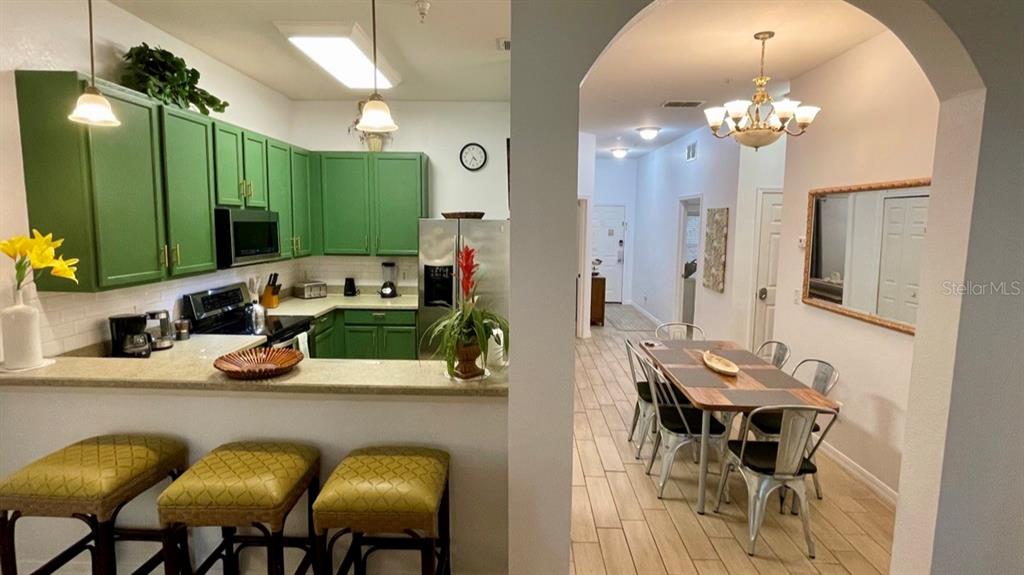 202 Rum Run, Unit 36102 Davenport, FL 33897 - Photo 6 of 21 a view of a dining room with furniture and chandelier